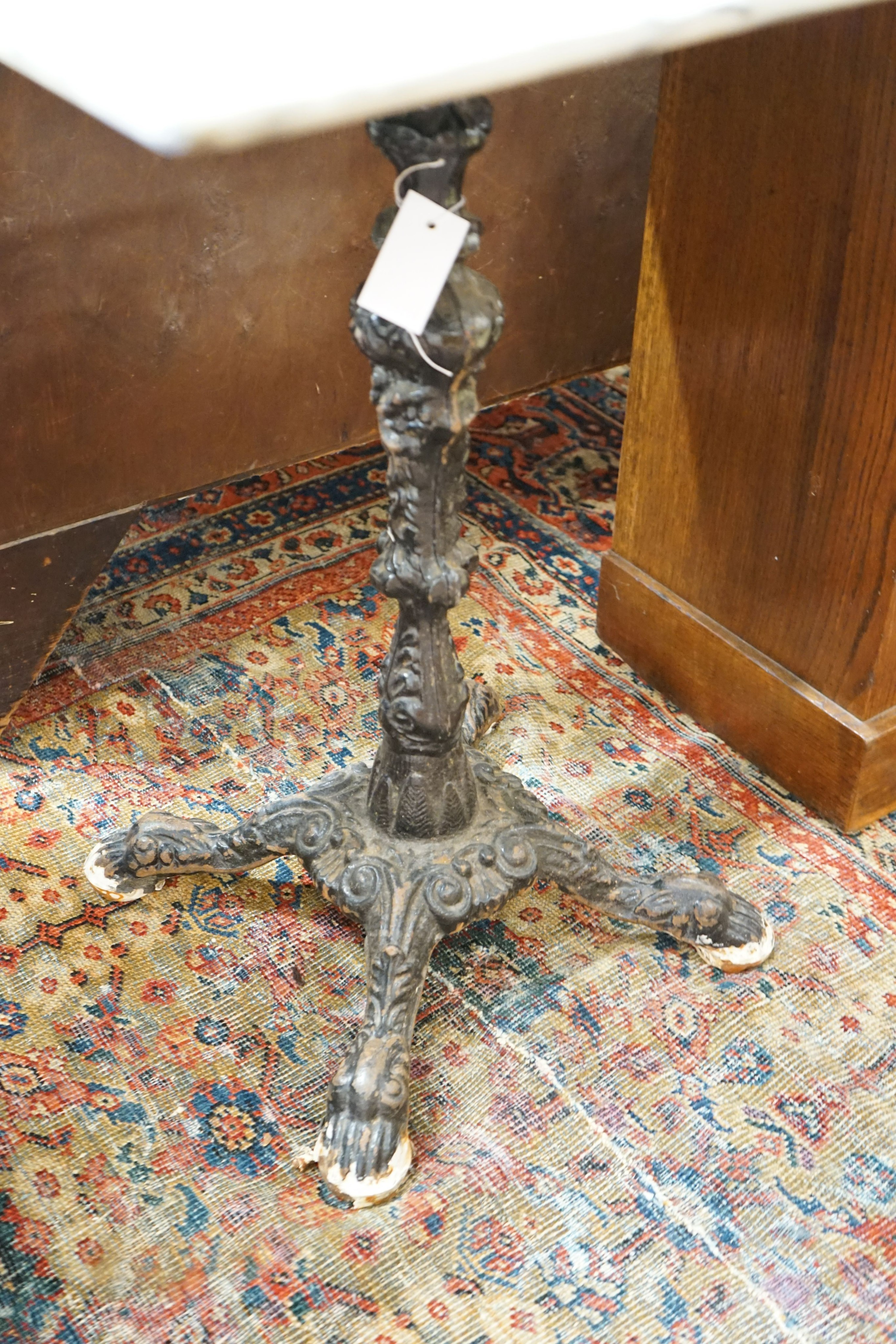A square reconstituted marble and cast iron garden table, width 60cm height 74cm